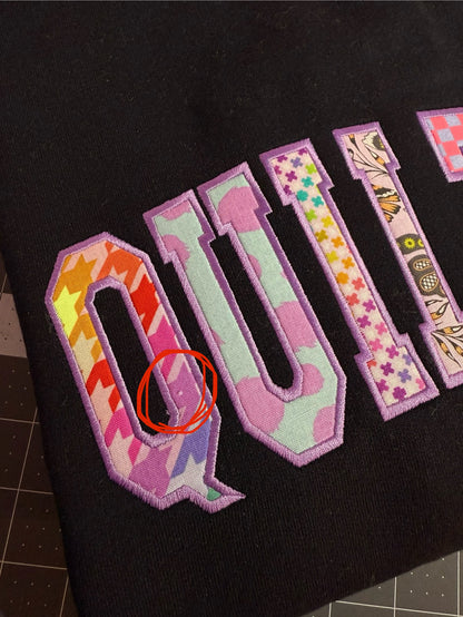 Black Medium QUILTER crewneck - OUPS (small missing print spot)