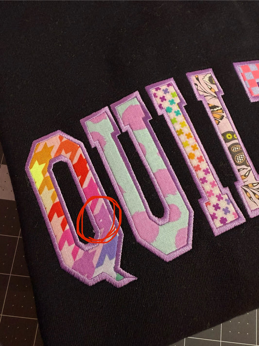 Black Medium QUILTER crewneck - OUPS (small missing print spot)