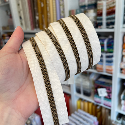 Cream - Antique Brass Coil Zipper Tape # 5 Zipper (1 Meter)